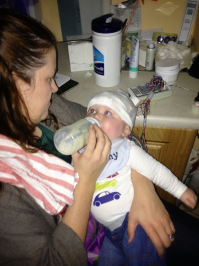 Emma giving Mattie a bottle during his 2nd EEG